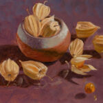 Cape Gooseberries, hand pinch pot, suspended on glass on purple background.